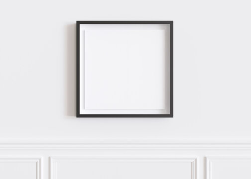 Blank square picture frame hanging on white wall. Template, mock up for your artwork, picture or poster. Empty, copy space. Close up view. Simple, minimalist mockup. 3D rendering.