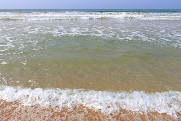 Wave on the sand beach background 