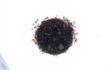 Fototapeta premium resh fermented black tea made from flowers, herbs, leaves and berries on white paper background.