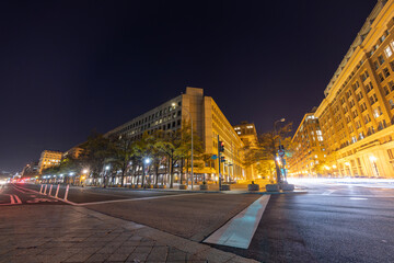 The J. Edgar Hoover Building, headquarters of the Federal Bureau of Investigation (FBI), in Washington, DC, seen at night from the intersection of Pennsylvania Avenue NW and 9th Street NW.