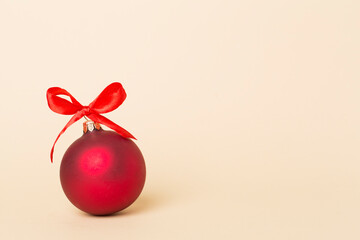 Christmas ball toy on color background