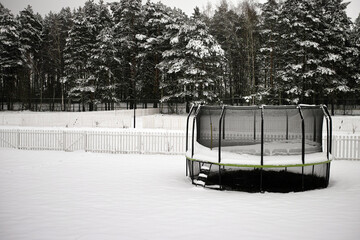 trampoline covered with snow