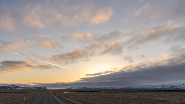 Asphalt road in countryside under sky