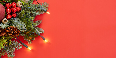 christmas decoration with lights on red wallpaper