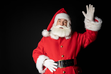 Santa Claus sends congratulations and greetings on a black background.