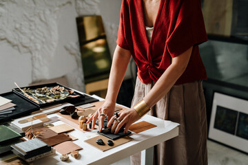 Close up of female interior designer working at her workshop