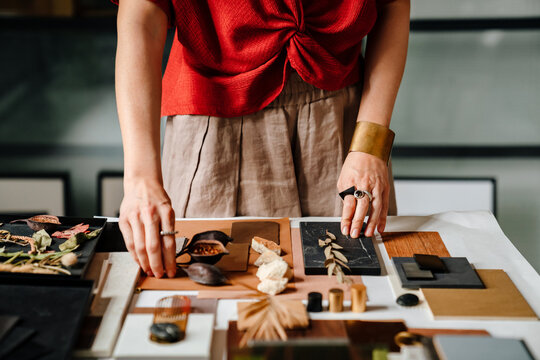 Close Up Of Female Interior Designer Working At Her Workshop