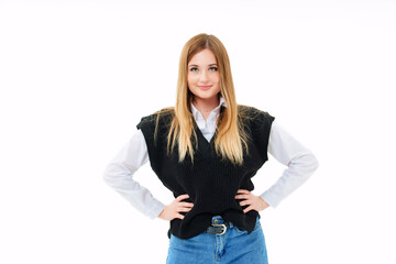 a blonde with sequins on face in a black knitted vest on a white background.