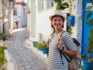 Marmaris is resort town on Turkish Riviera, also known as Turquoise Coast. Marmaris is great place for sailing and diving. Tourist Woman on Beautiful Streets of old Marmaris.