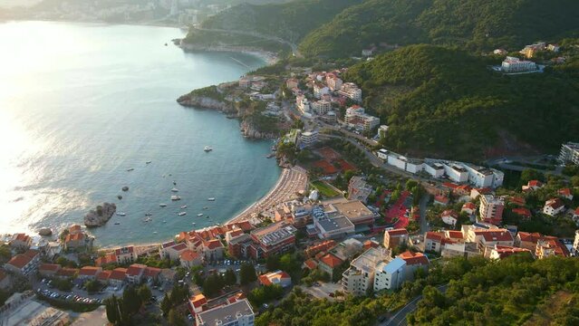 Aerial video of the Przno beach near the city of Budva during sunset. It is situated close to the Sveti Stefan island. Travel to Montenegro concept