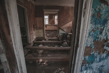 Fototapeta na wymiar Inside a destroyed rural house in the exclusion zone, Pripyat region, Chernobyl disaster, Ukraine