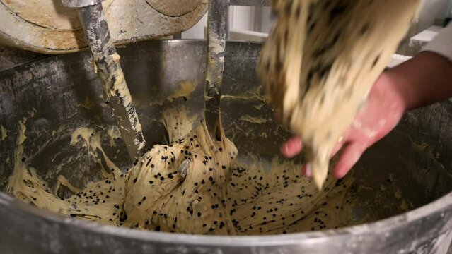 Preparing the panettone dough in the industrial mixer. High quality 4k footage