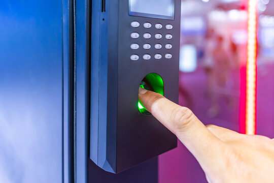 Staff push down electronic control machine with finger scan to access the door of or data center. The concept of data security or data access control.