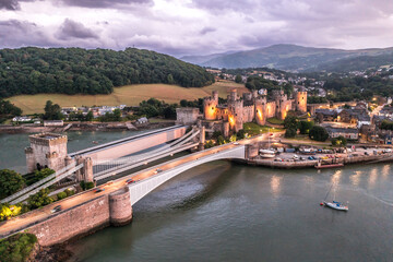Fototapeta na wymiar Aerial view with Conwy town and the medieval castle, the famous landmark of Wales and UK, captured at sunset