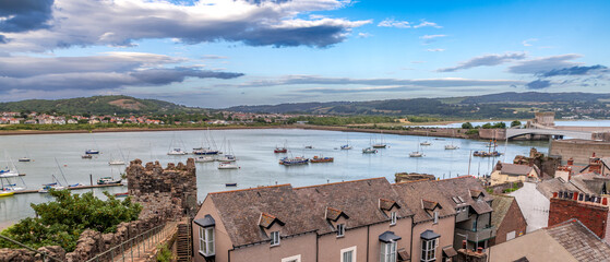 Conwy town and The Castle, the awesome landmark medieval fortress in Wales, UK captured at sunset