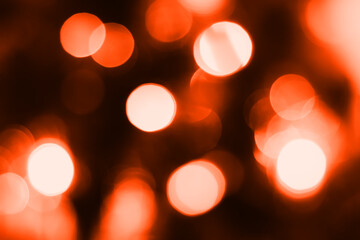 Blurred lights, dark orange background. Abstract bokeh with soft light