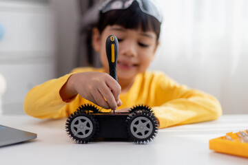 Asia students learn at home in coding robot cars and electronic board cables in STEM, STEAM,...