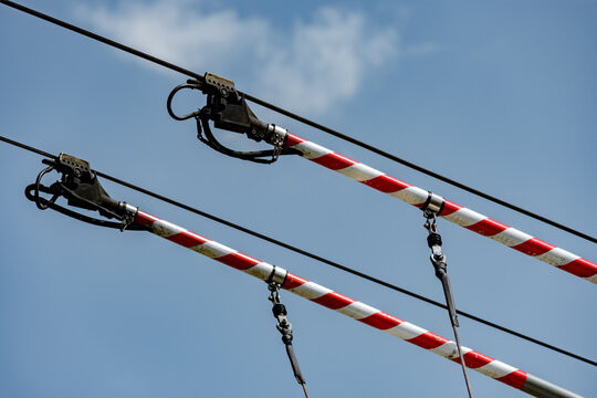 Electric bus poles connected on wires