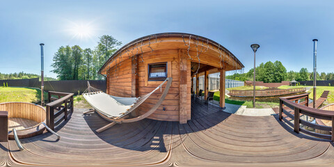 full seamless hdri 360 panorama near wooden vacation homestead house with hammock in...