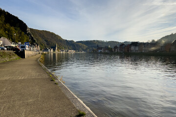 Fototapeta premium Empty pier alongside the Meuse river in Dinant, Belgium