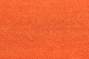 closeup to a textured orange rough fabric