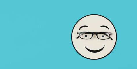 Head with a smiling face and eyeglasses, mental health concept, positive mindset, support and evaluation symbol
