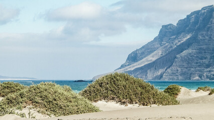 Beach and mountains - beautiful coast in Caleta de Famara, Lanzarote Canary Islands.