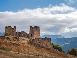 Fototapeta na wymiar Majestic ancient tower buildings of Kelly in the Assinesky Gorge of mountainous Ingushetia, one of the medieval castle-type tower villages, located on the extremity of the mountain range, Russia.