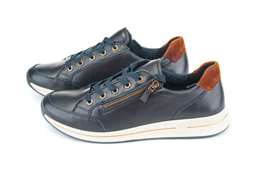 Pair of modern black sport sneakers close up isolated on white background