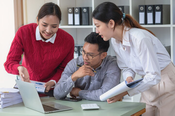 Marketing, Finance, Accounting, Planning, A team of businessmen plan with their laptops and graph charts for their profits and use a calculator to calculate their company is annual balance.