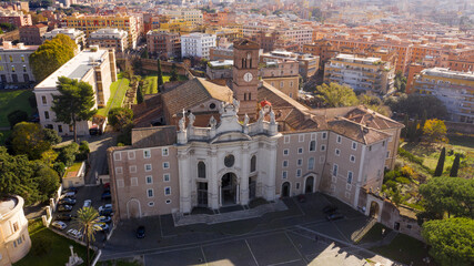 Fototapeta na wymiar Aerial view of Basilica of the Holy Cross in Jerusalem, a Catholic Minor basilica in Rome, Italy. It is one of the Seven Pilgrim Churches of the city.