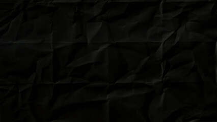 Old black wrinkled paper crumpled rough texture background