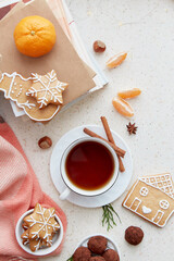 Christmas food - coffee, homemade cookies, tangerines, hazel, truffles near books flat lay. Good holidays festive mood background