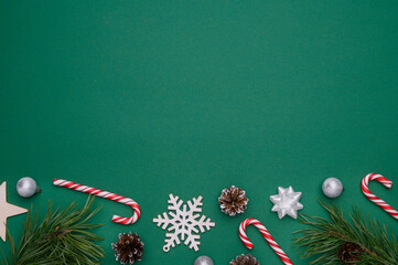 Christmas, winter layout on a green background. Concept of christmas, winter, new year. Flat lay, top view. Copy space.