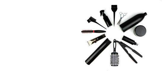 Set hairdresser's accessories on white background. Composition with scissors, , spray, shampoo, brush, curling iron, comb, hair clipper, other hairdresser's accessories on white background.
