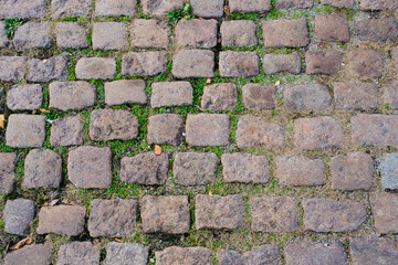Old stone paving stones, road surface.