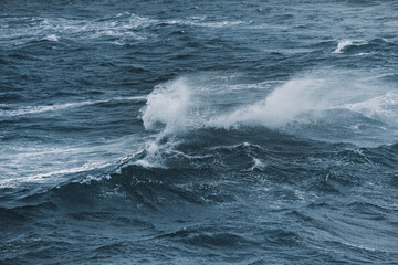 Crashing wave during storm on a cold winter day