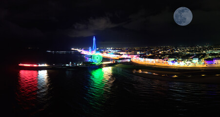 An aerial view of the illuminations at Blackpool under a full moon in Lancashire, UK