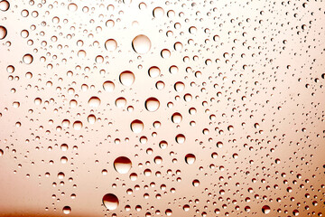 The effect of rain on a colored background.