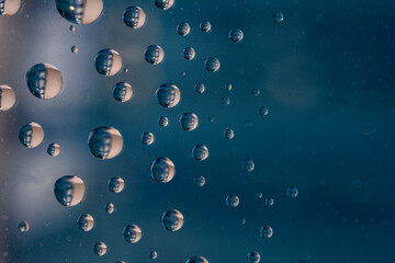 The effect of rain on a colored background.