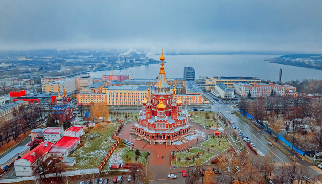 St. Michael the Archangel Cathedral. Aerial View. Beautiful cathedral with golden domes. The main architectural landmark of Izhevsk, Russia. Popular tourist destination. Izhevsk Pond in the background