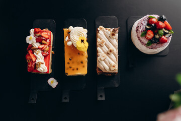 Pavlova dessert made of fresh meringue with cream cheese decorated with berries.