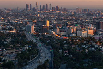 The 101 freeway leading into the downtown Los Angeles skyline at dusk