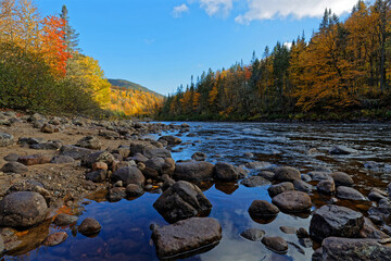 Rocks andcolored forest around the Jacques-Cartier river in the National Park, Quebec