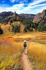 Hiker along Boulder, Colorado's Mesa Trail in the fall