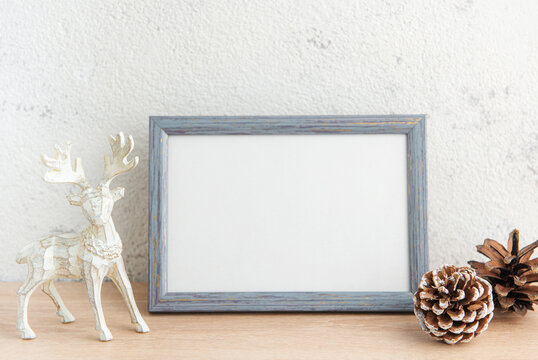 White blank wooden frame mockup with Christmas decorations