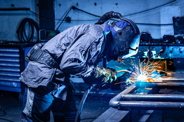Fototapeta Welder erecting technical steel obraz