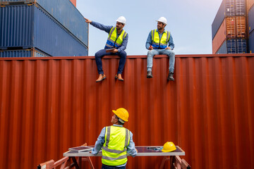 The professional engineers' team is discussing solar photovoltaic panels installed in a container shipping company. The photovoltaic panels are for the conversion of thermal energy into electricity
