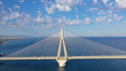 Aerial drone photo of famous state of the art modern cable strait bridge of Rio Antirio crossing corinthian gulf from Peloponnese seaside city of Rio to Antirio - mainland Greece