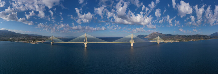 Aerial drone photo of famous state of the art modern cable strait bridge of Rio Antirio crossing corinthian gulf from Peloponnese seaside city of Rio to Antirio - mainland Greece